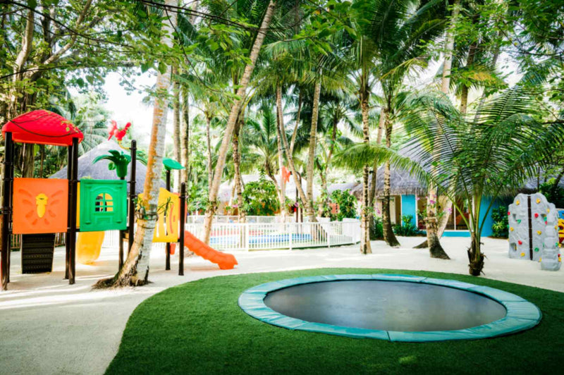 Children playing on a trampoline at Niyama Private Islands