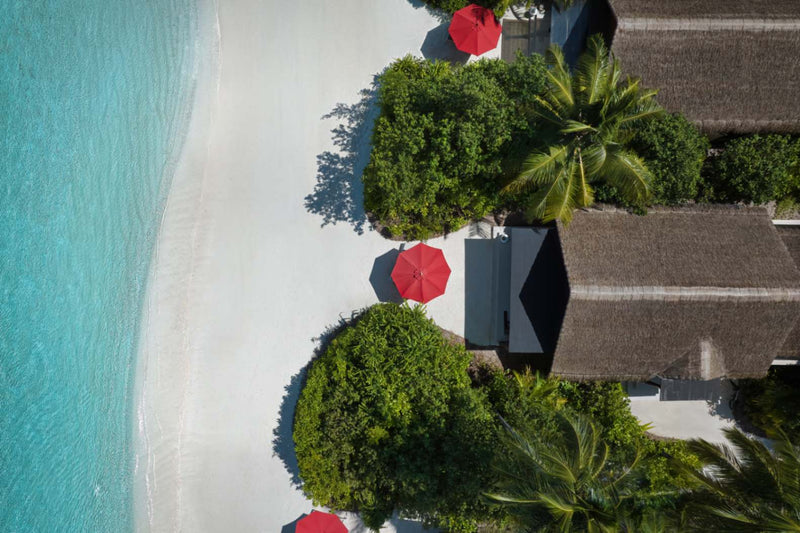 Beach Villas fronting the sand at Niyama Private Islands, seen from the air