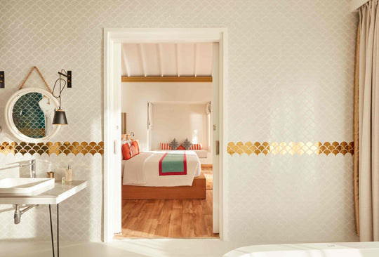 Sun Siyam Iru Veli, Dhaalu Atoll — bathroom looking through an open doorway to the bedroom