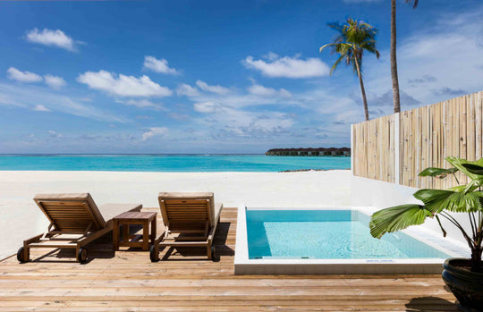 Sun Siyam Olhuveli, South Malé Atoll — private pool on the deck facing the lagoon, with sun loungers