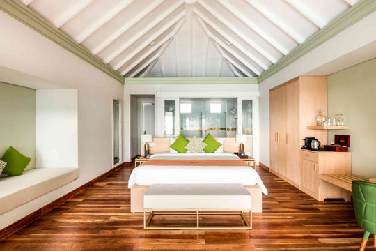 Sun Siyam Olhuveli, South Malé Atoll — Grand Water Villa with Pool bedroom under a pitched ceiling