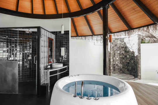 Bathtub in a Deluxe Beach Villa at Sun Siyam Iru Fushi, on the sand