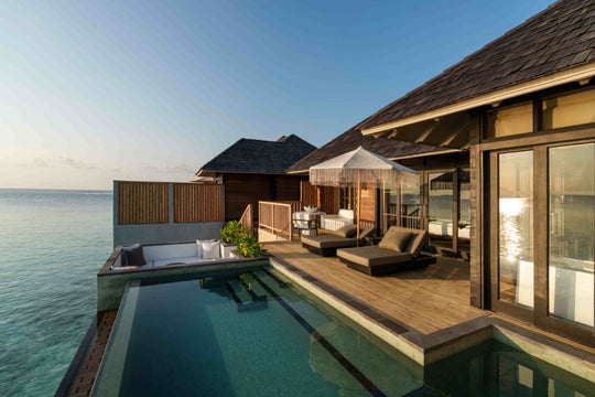 Sunset Horizon Water Villa with Pool at Sun Siyam Iru Fushi from outside, 129 sq m over the lagoon, west facing