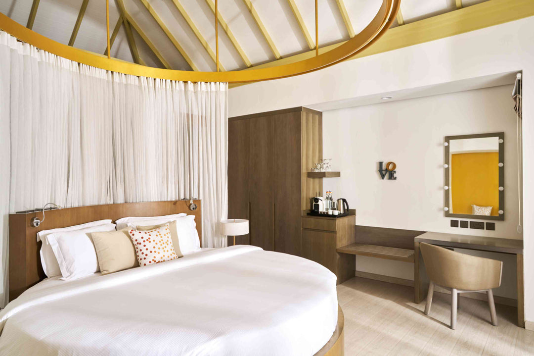 Overwater villa accommodation for two adults at Sun Siyam Romance, Maldives