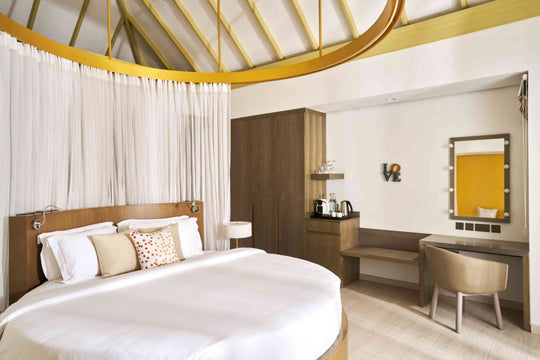 Overwater villa accommodation for two adults at Sun Siyam Romance, Maldives