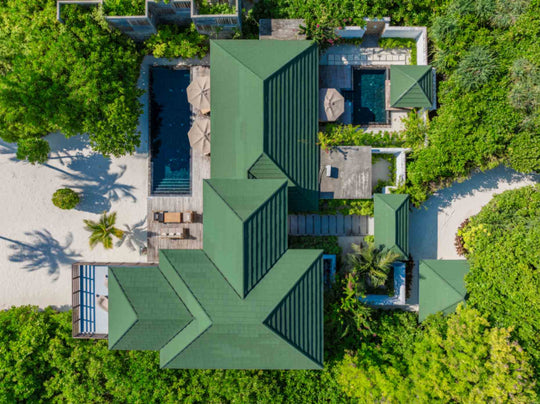 Aerial view of a villa with an upgraded private pool and the lagoon beyond at Siyam World, Noonu Atoll, Maldives