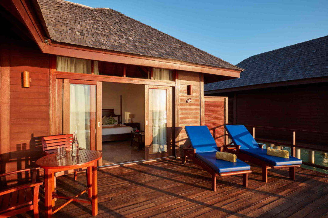 Sun Siyam Olhuveli, South Malé Atoll — Deluxe Water Villa deck with sun loungers above the lagoon
