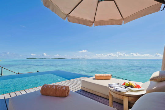 The pool of a lagoon suite at Ayada Maldives, its edge level with the water beyond