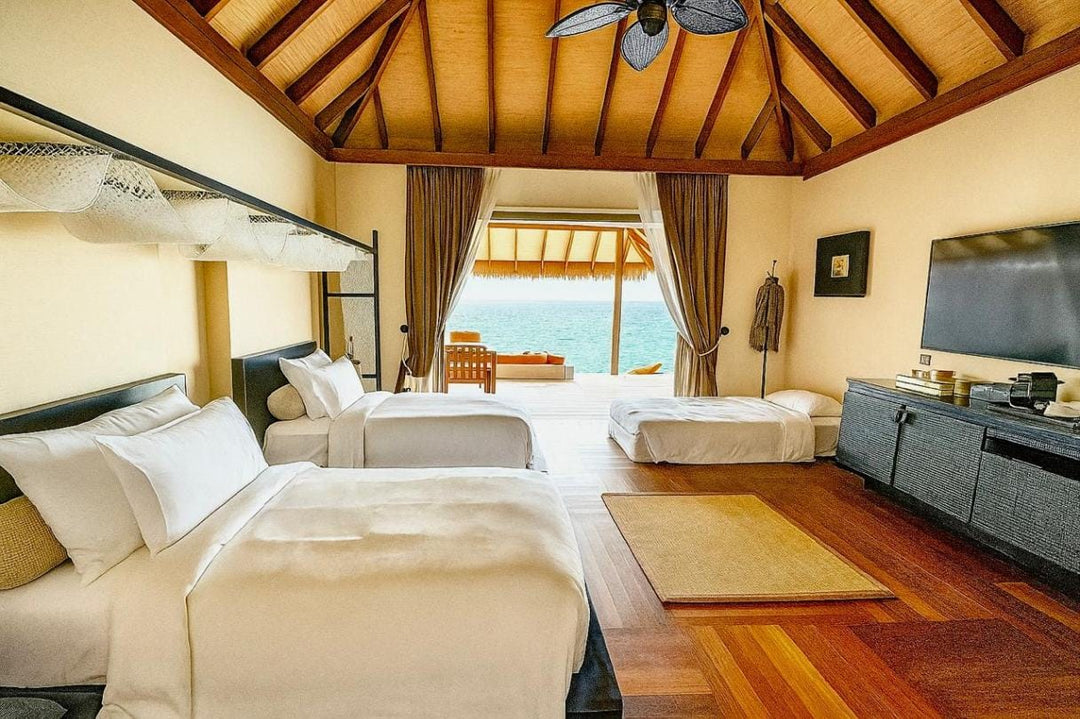 The twin bedded room of a family ocean suite at Ayada Maldives