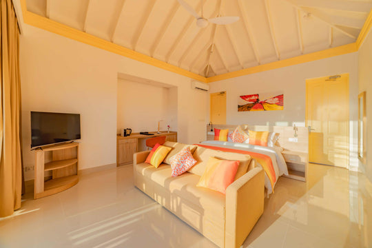 Bedroom and outlook of a Sunset Pool Beach Villa at Siyam World, Noonu Atoll, Maldives