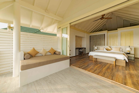 Bed and sleeping area of a Two Storey Pool Beach Residence at Siyam World, Noonu Atoll, Maldives
