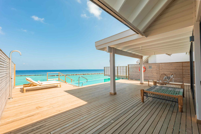 Water Pool Villa, Lagoon View at ananea Madivaru Maldives, sun loungers on the deck looking out over the lagoon