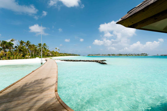 The arrival jetty at ananea Madivaru Maldives looking back towards the beach and the reef