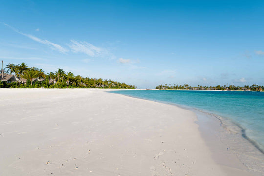 The shoreline at ananea Madivaru Maldives, the beach curving away towards the villas