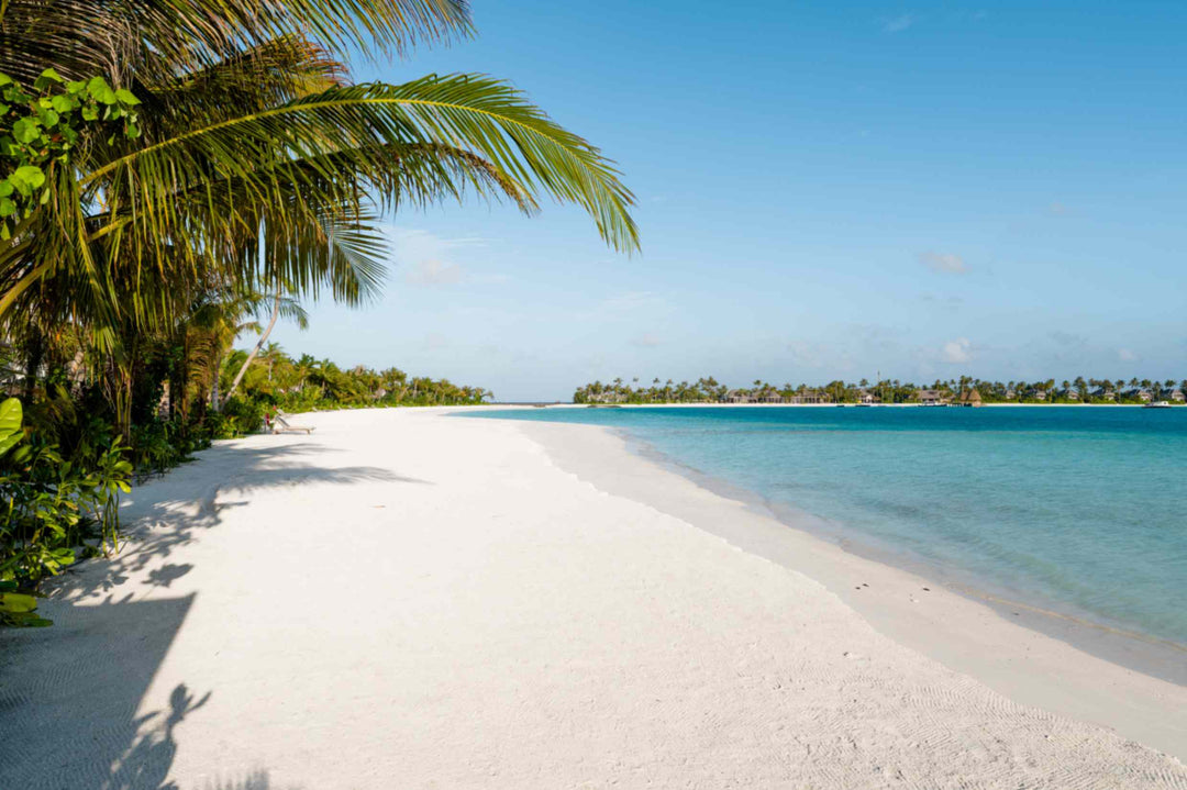 The beach at ananea Madivaru Maldives, white sand running into shallow turquoise water