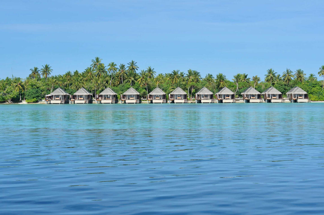 The overwater villas at Ayada Maldives seen from the lagoon at water level