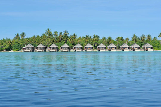 The overwater villas at Ayada Maldives seen from the lagoon at water level
