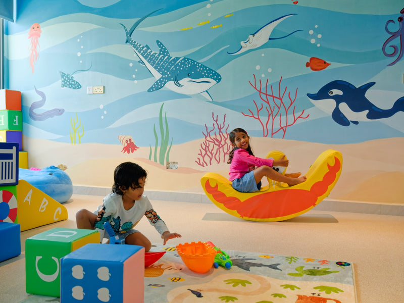 h78 Guraidhoo, South Malé Atoll: children playing in the kids club, with a sea-life mural on the wall