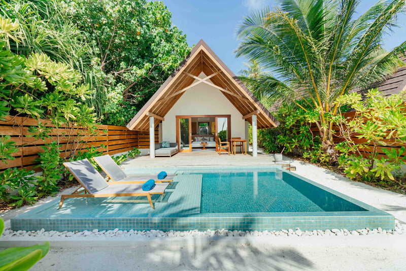 A Pool Beach Villa Sunset at Fushifaru Maldives.