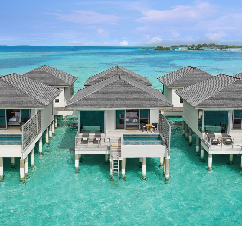 An Overwater Villa with Pool at Le Méridien Maldives Resort & Spa seen from the air