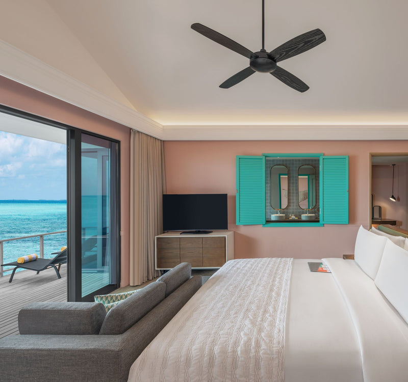 The mid-century interior of an Overwater Pool Villa at Le Méridien Maldives Resort & Spa