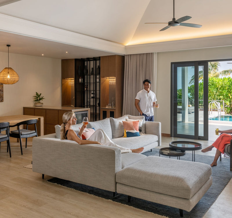 The living area of the Thilamaafushi Three Bedroom Villa at Le Méridien Maldives Resort & Spa