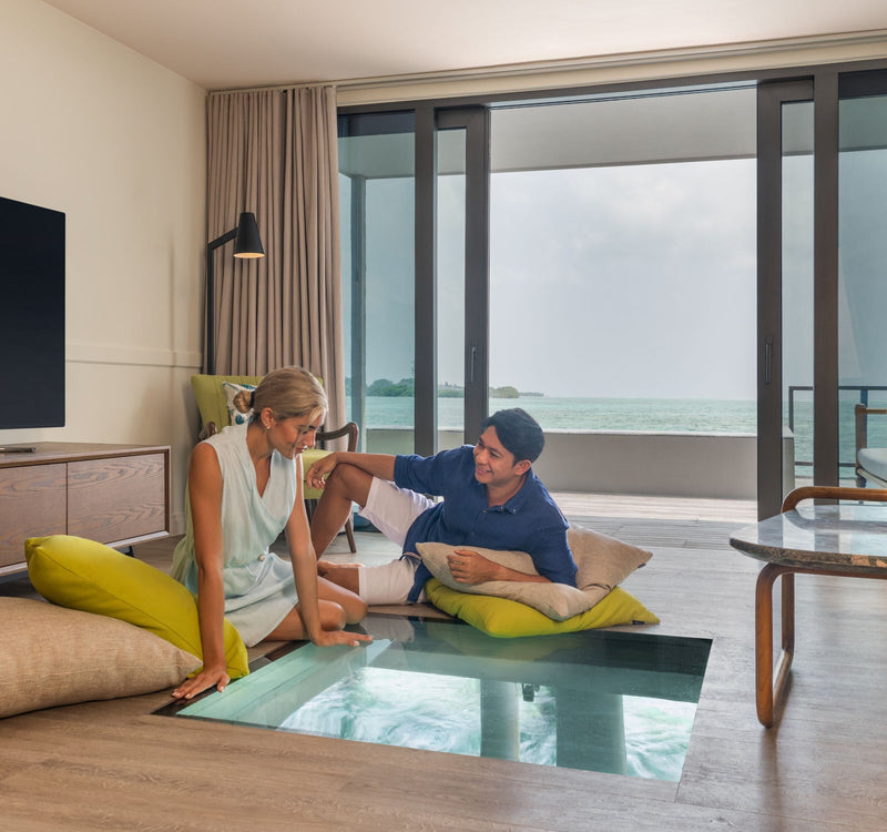 The living room of a Two Bedroom Overwater Pool Villa at Le Méridien Maldives Resort & Spa