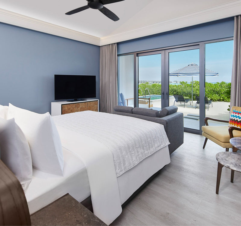 A Two Bedroom Beach Villa at Le Méridien Maldives Resort & Spa, looking out to the beach