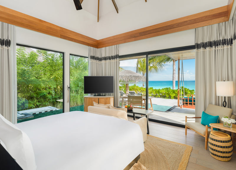 The bedroom of a One-Bedroom Family Beach Pool Villa at Hilton Maldives Amingiri Resort & Spa.