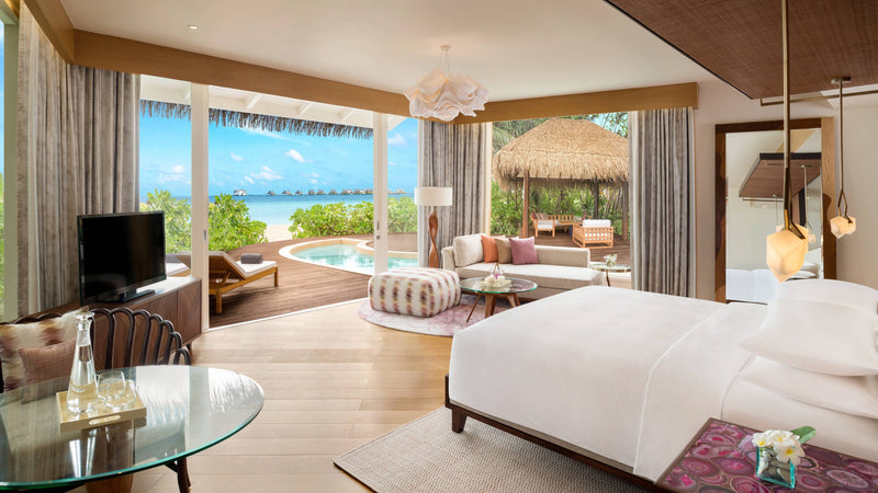 The bedroom of a Duplex Beach Pool Villa at JW Marriott Maldives Resort & Spa