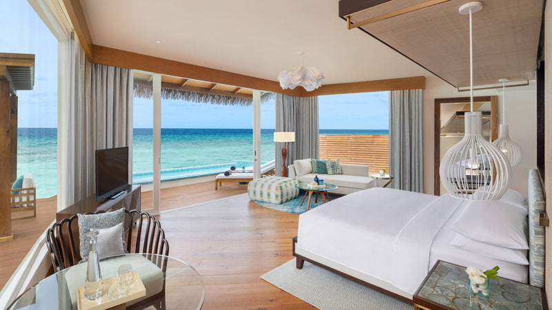The bedroom of a Duplex Overwater Pool Villa at JW Marriott Maldives Resort & Spa