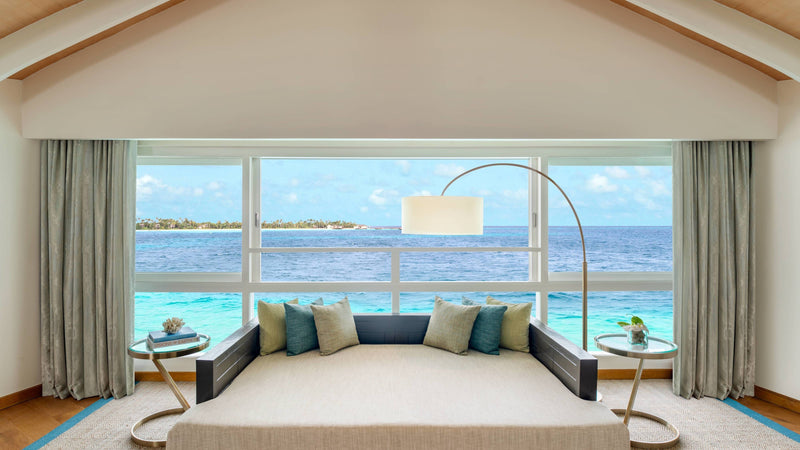 The lounge of a Duplex Overwater Pool Villa at JW Marriott Maldives Resort & Spa
