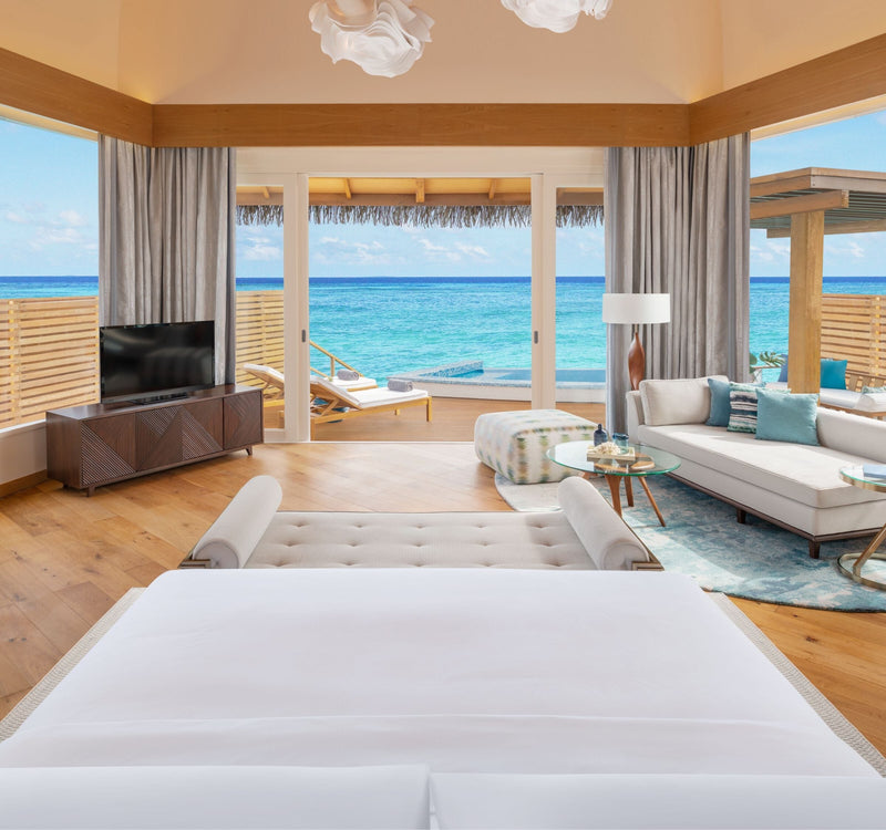 The bedroom of an Overwater Pool Villa Sunset at JW Marriott Maldives Resort & Spa