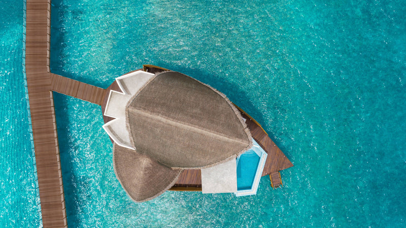 An Overwater Pool Villa Sunrise at JW Marriott Maldives Resort & Spa, seen from above