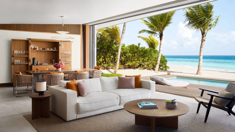 The living room of a Two-Bedroom Beach Pool Villa at The Ritz-Carlton Maldives, Fari Islands