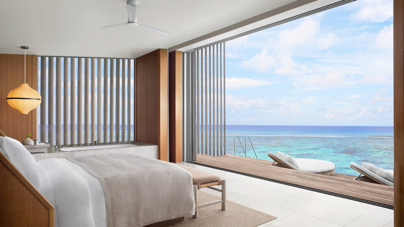 The master bedroom of a Two-Bedroom Water Villa at The Ritz-Carlton Maldives, Fari Islands