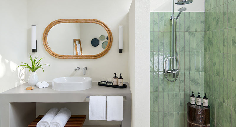 The bathroom of a Deluxe Sunset Villa with Pool at NH Collection Maldives Reethi Resort.