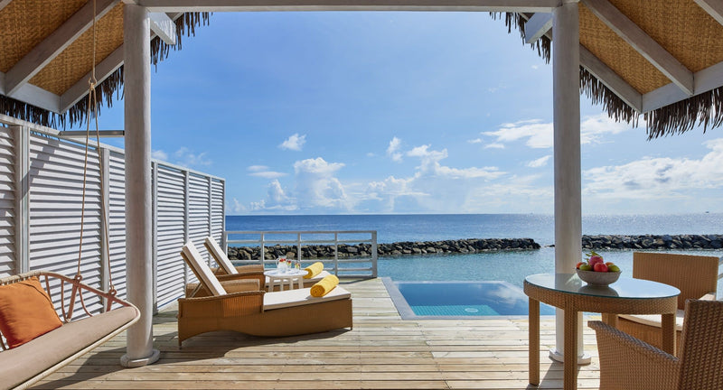 NH Maldives Kuda Rah Resort, South Ari Atoll: the view from a One Bedroom Over Water Pool Villa, its shaded deck and pool looking out to the ocean.