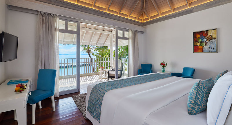 NH Maldives Kuda Rah Resort, South Ari Atoll: the bedroom of a One Bedroom Beach Pool Pavilion Suite.