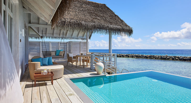 NH Maldives Kuda Rah Resort, South Ari Atoll: the deck of the Over Water Royal Residence, with a private pool, a shaded lounge and a sea view.