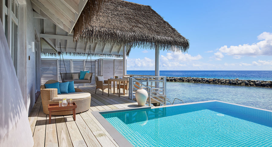 NH Maldives Kuda Rah Resort, South Ari Atoll: the deck of the Over Water Royal Residence, with a private pool, a shaded lounge and a sea view.