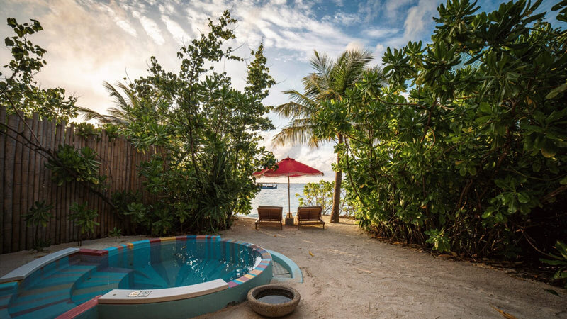 The private plunge pool of a Haruge Beach Villa at Oaga Art Resort, with the beach beyond