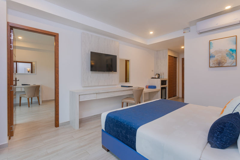 Deluxe double room with a balcony facing the village at Kaani Palm Beach