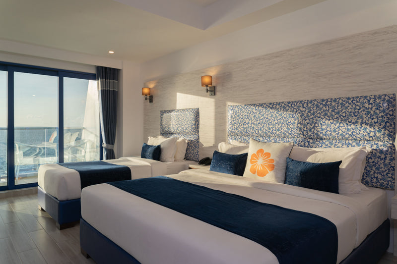 Family sea-view room at Kaani Palm Beach with a large window to the sea