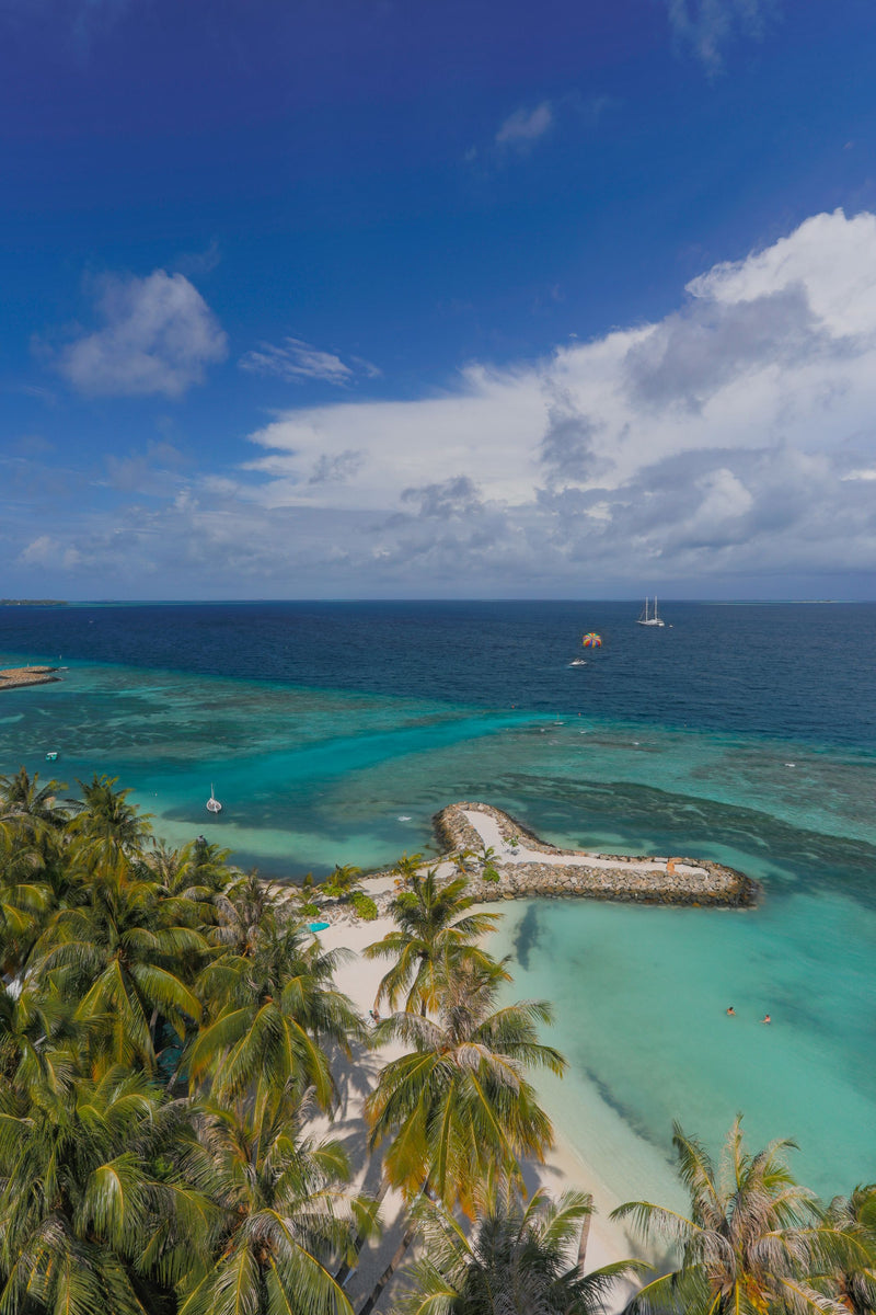 Aerial view of the Maafushi lagoon and reef seen from Kaani Palm Beach