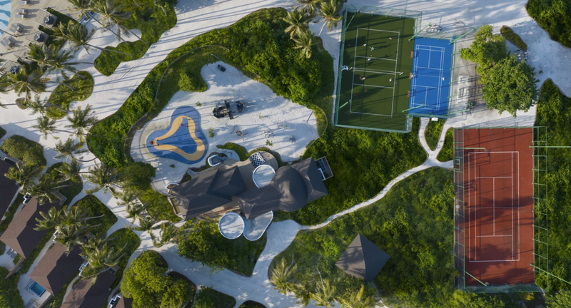 The children's playground and sports courts at Avani+ Fares Maldives, from the air.