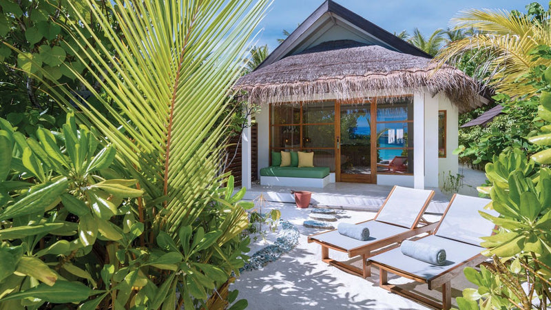 OBLU SELECT Sangeli, North Malé Atoll: a thatched beach villa in the garden, with sun loungers on its terrace