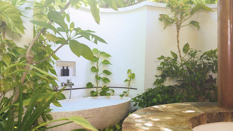 OBLU SELECT Sangeli, North Malé Atoll: a garden bathroom with a freestanding bath among plants