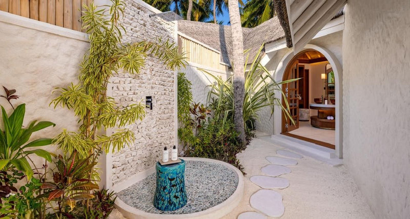 An outdoor bathroom in a garden at RAH GILI Maldives.