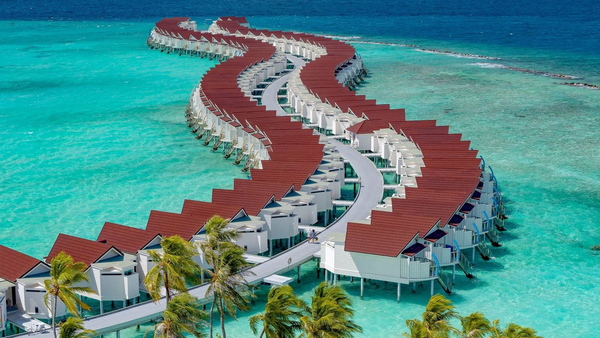 OBLU Xperience Ailafushi, North Malé Atoll: the curving rows of overwater villas from the air